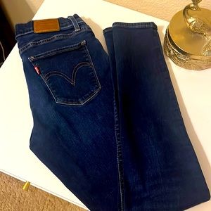 Levi’s dark washed curvy skinny premium denim.